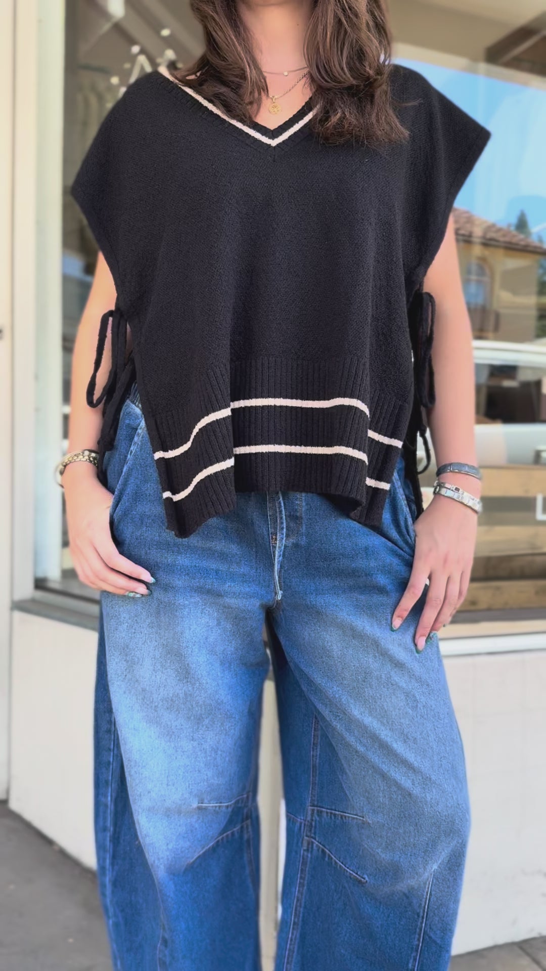 sweater vest with side tie and barrel jeans
